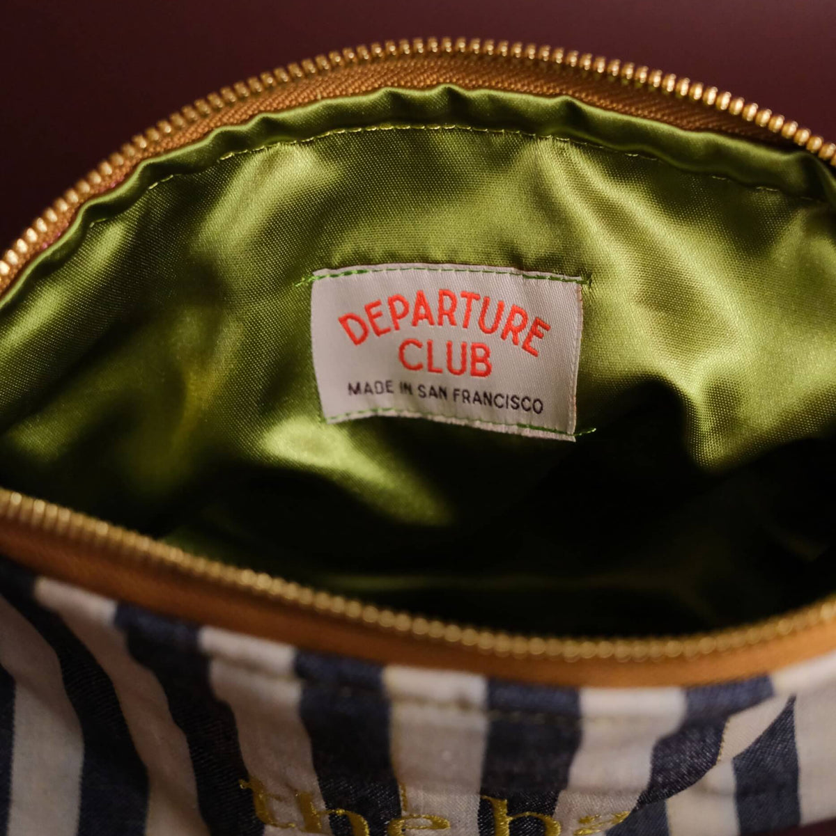 The bay stripe travel zip