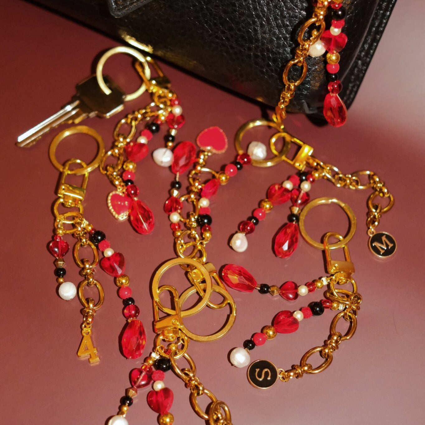 Beaded bag charm in rouge noir