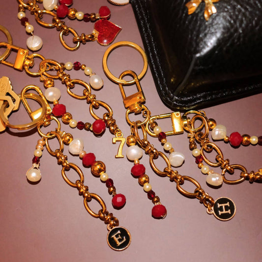 Beaded bag charm in bordeaux pearl