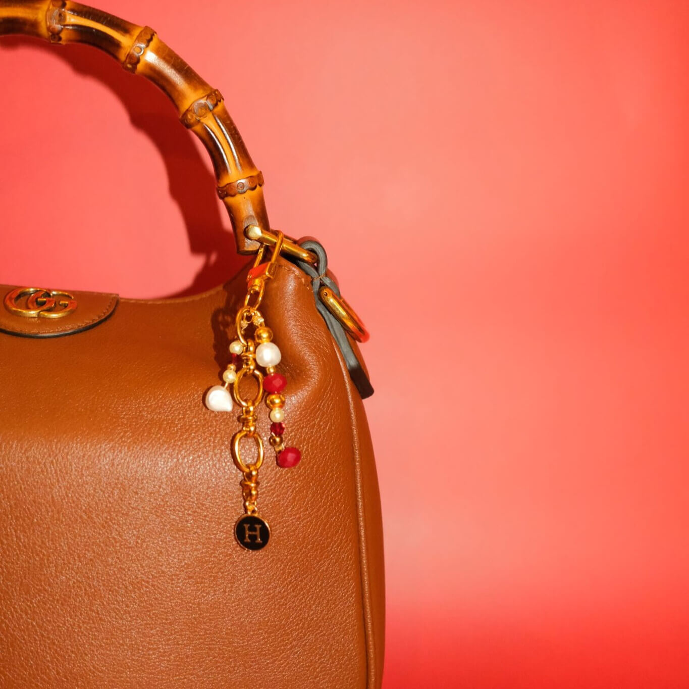 Beaded bag charm in bordeaux pearl