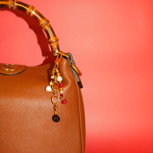 Beaded bag charm in bordeaux pearl