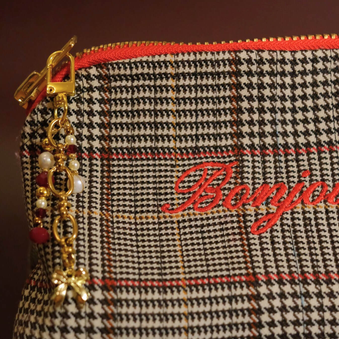 Beaded bag charm in bordeaux pearl