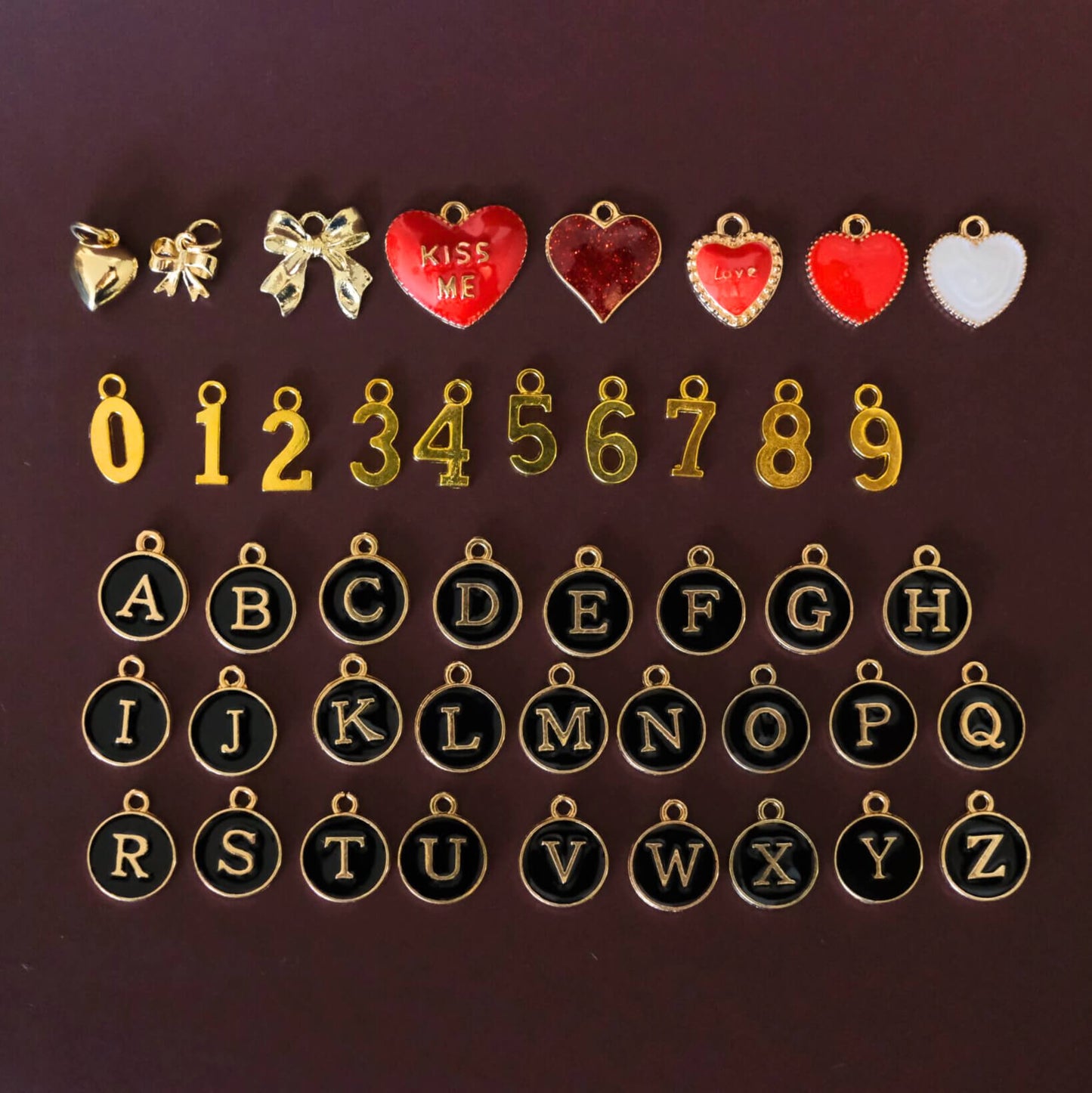 Beaded bag charm in bordeaux pearl